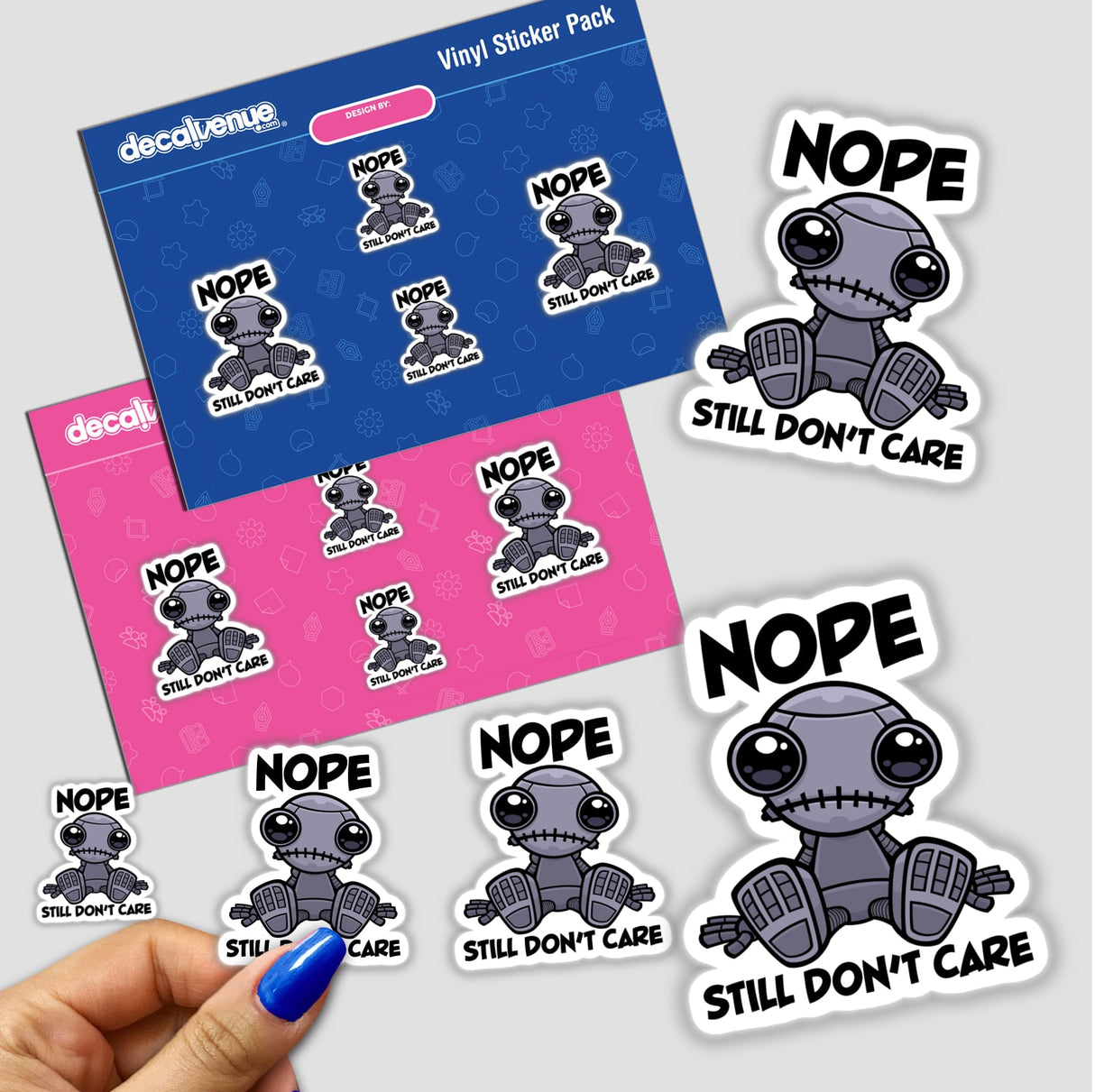 Nope Still Don't Care Cute Indifferent Robot sticker pack, featuring cartoon robot designs, held by a hand. Available as vinyl stickers or digital artwork.