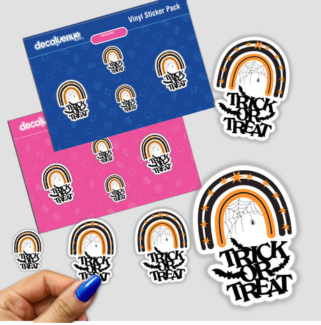 Hand holding a sticker pack featuring the Trick or Treat black and orange rainbow with bats and a spider web, from Decal Venue's unique stickers collection.
