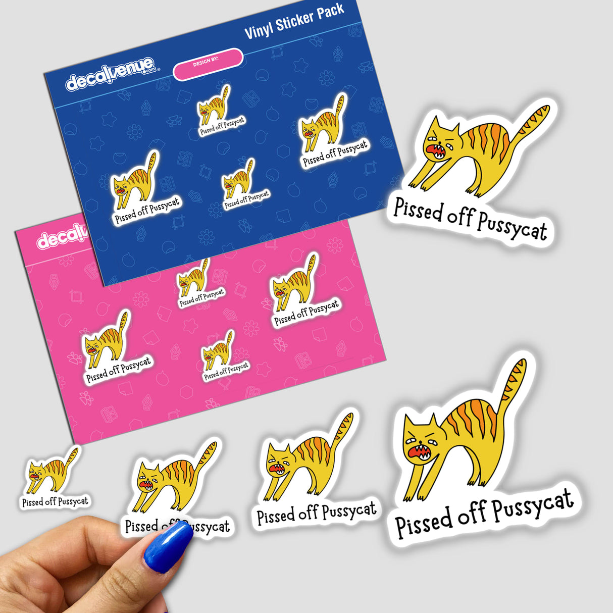 Hand holding Pissed Off Pussycat stickers featuring cartoon cats with expressive faces, available as stickers or digital artwork.