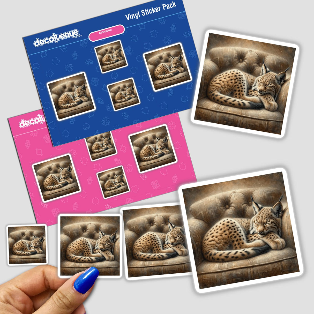 Hand holding a sticker pack featuring a lynx cub curled up on a cushioned chair, available as stickers or digital artwork.