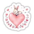 Baby Bunny on a Heart: A cartoon bunny lovingly nestled on a heart, ideal as a sticker or digital art from Decal Venue, showcasing charm and playful warmth.