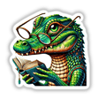 Cartoon of a crocodile wearing reading glasses and holding an open book, available as stickers or digital artwork titled Crocodile With Reading Glasses Open Book from Decal Venue.