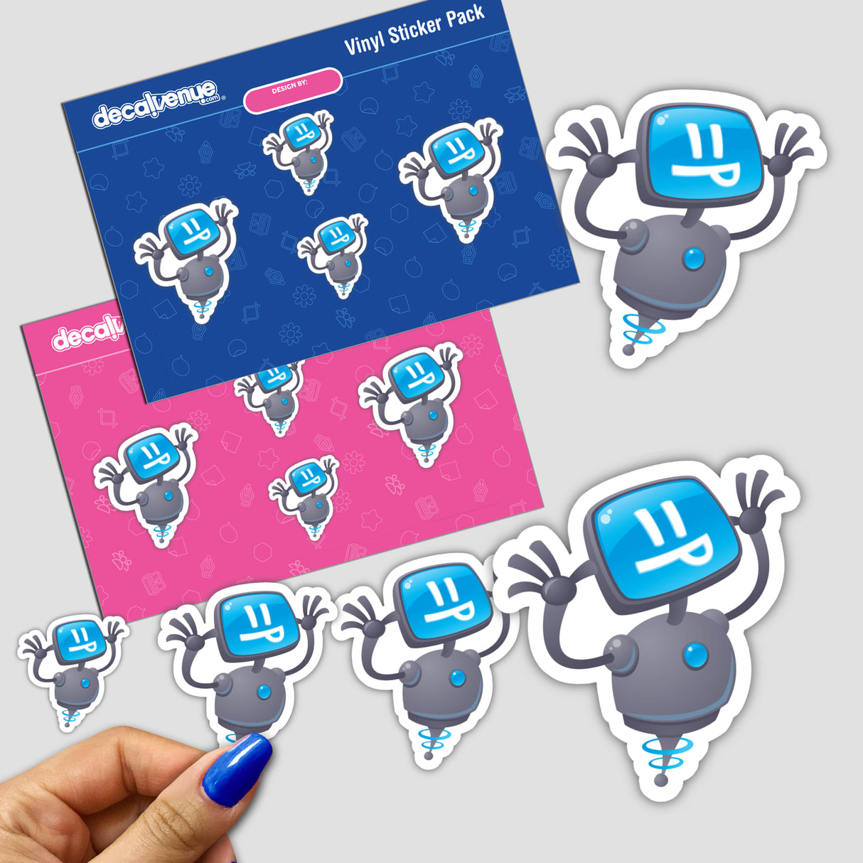 Razzbot stickers featuring cartoon robot characters, available in a pack or individually. A person's hand with blue nail polish holds one sticker, showcasing Decal Venue's unique design.