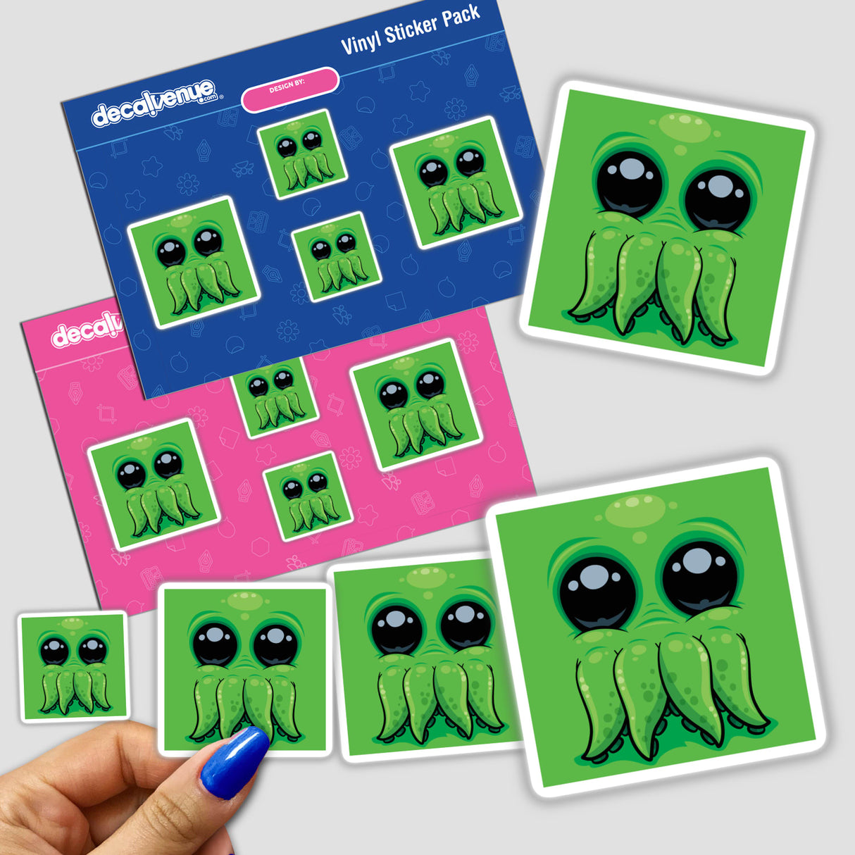 Cutethulhu Cute Cthulhu Face sticker pack held in a hand, featuring cartoon characters with playful expressions, available as unique stickers or digital artwork from Decal Venue.