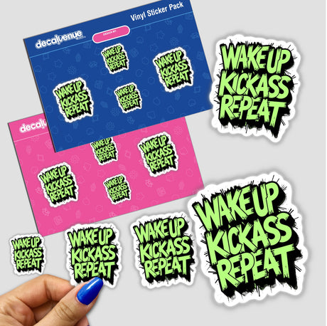 Hand holding Wake Up Kick Ass Repeat stickers, available as vinyl stickers or digital artwork from Decal Venue, showcasing a motivational quote in a bold design.