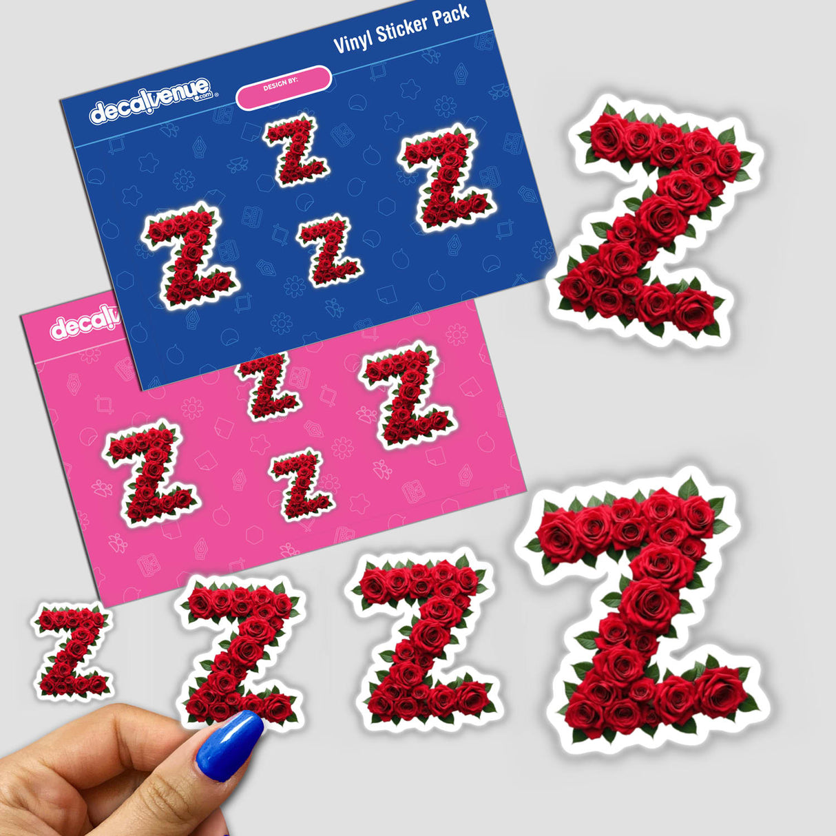 Hand holding Elegant Floral Letter Z Clipart - Downloadable Sticker with Commercial Rights, featuring intricate rose designs.