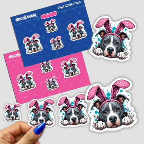 Peeking Easter Pitbull Bunny stickers featuring cartoon dog faces with pink ears and paws, held in a hand, showcasing the unique vinyl artwork from Decal Venue.