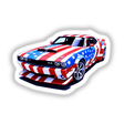 A Cool American Flag Muscle Car sticker features a detailed image of a sports car with a flag design, highlighting a white star on blue, ideal for auto enthusiasts.