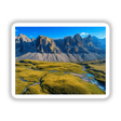 Majestic Rocky Cliffs Overlooking Verdant Valleys and Turquoise Streams, available as stickers or digital artwork, depicting a serene mountain landscape with flowing rivers and lush greenery.