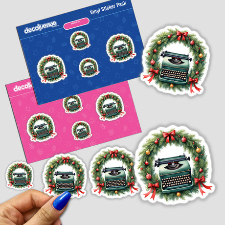 Hand holding a sticker pack featuring the Typewriter in a Christmas Wreath design from Decal Venue, showcasing vintage charm perfect for holiday decor.