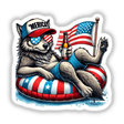 Wolf American Flag Float Merica sticker or digital art depicting a cartoon wolf in sunglasses and a hat, lounging on a float, holding a beer and an American flag.