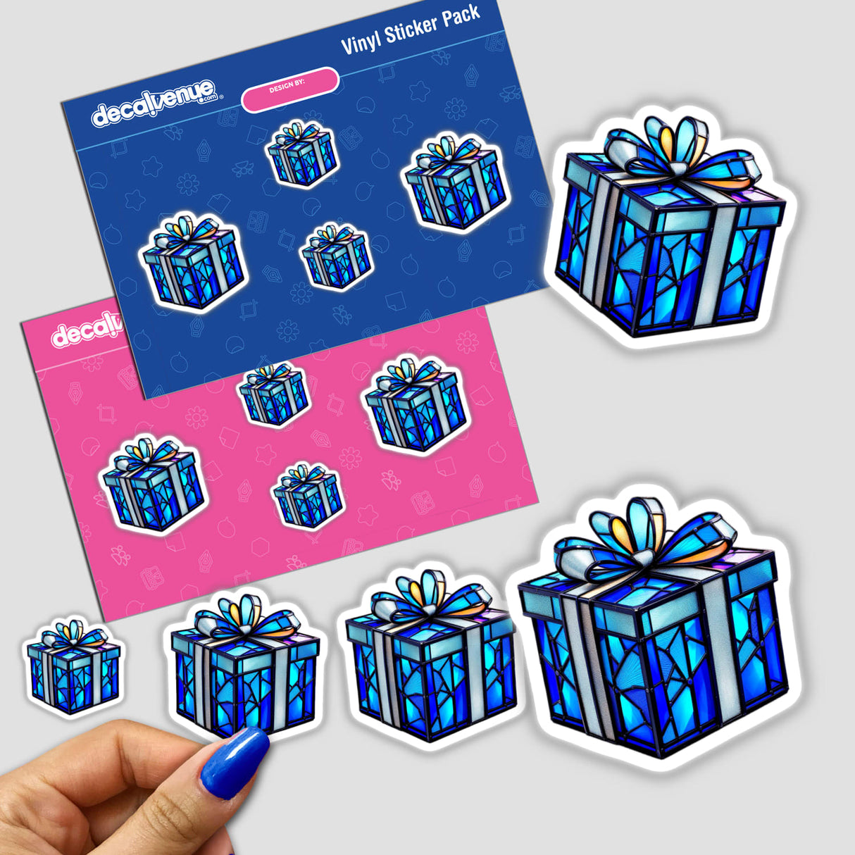 Hand holding a Hanukkah Gift Box Stained Glass Style sticker pack, featuring intricate designs. Available as stickers or digital artwork from Decal Venue's unique collection.