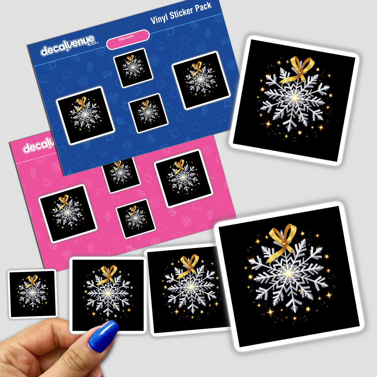 Silver Snowflake with Gold Ribbon and Twinkling Lights sticker pack, held in hand, showcasing intricate snowflake designs with elegant gold bows, available as stickers or digital artwork.