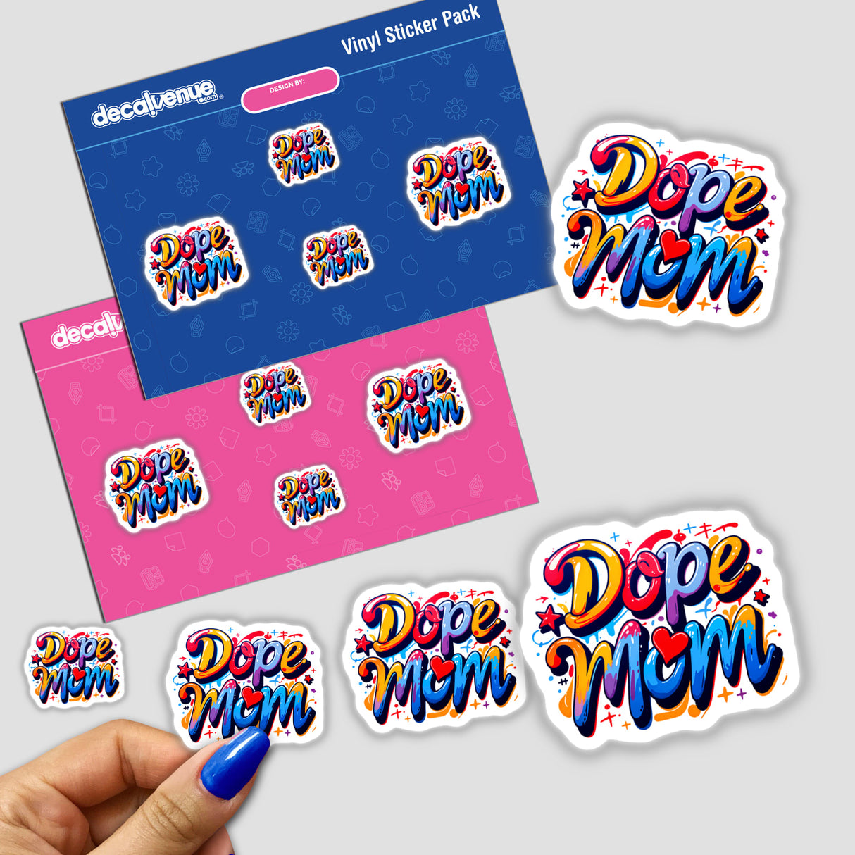 a hand holding a sticker next to a pack of stickers