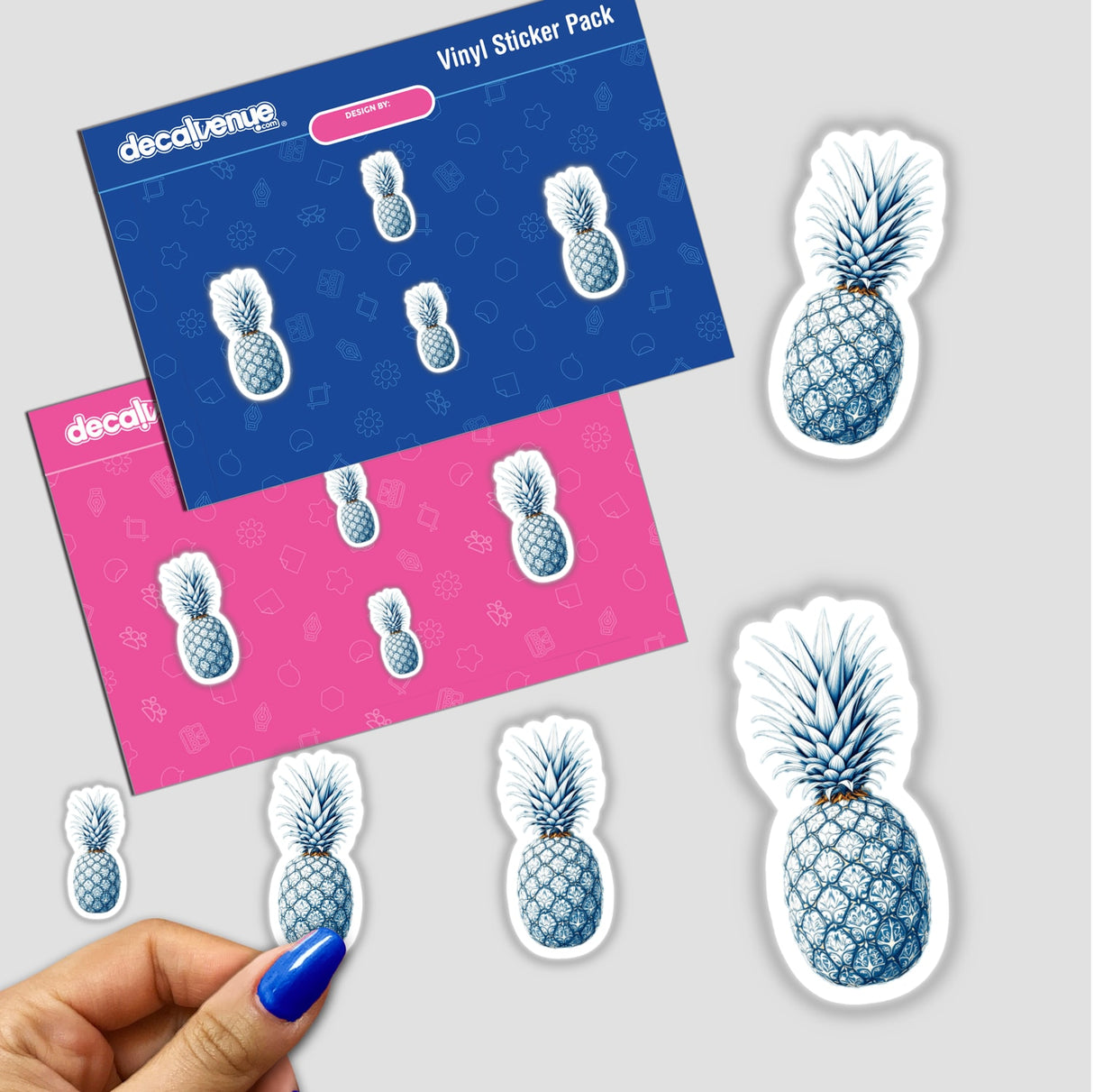 Chinoiserie Pineapple sticker pack held in hand, featuring intricate designs of pineapples, available as stickers or digital artwork from Decal Venue.