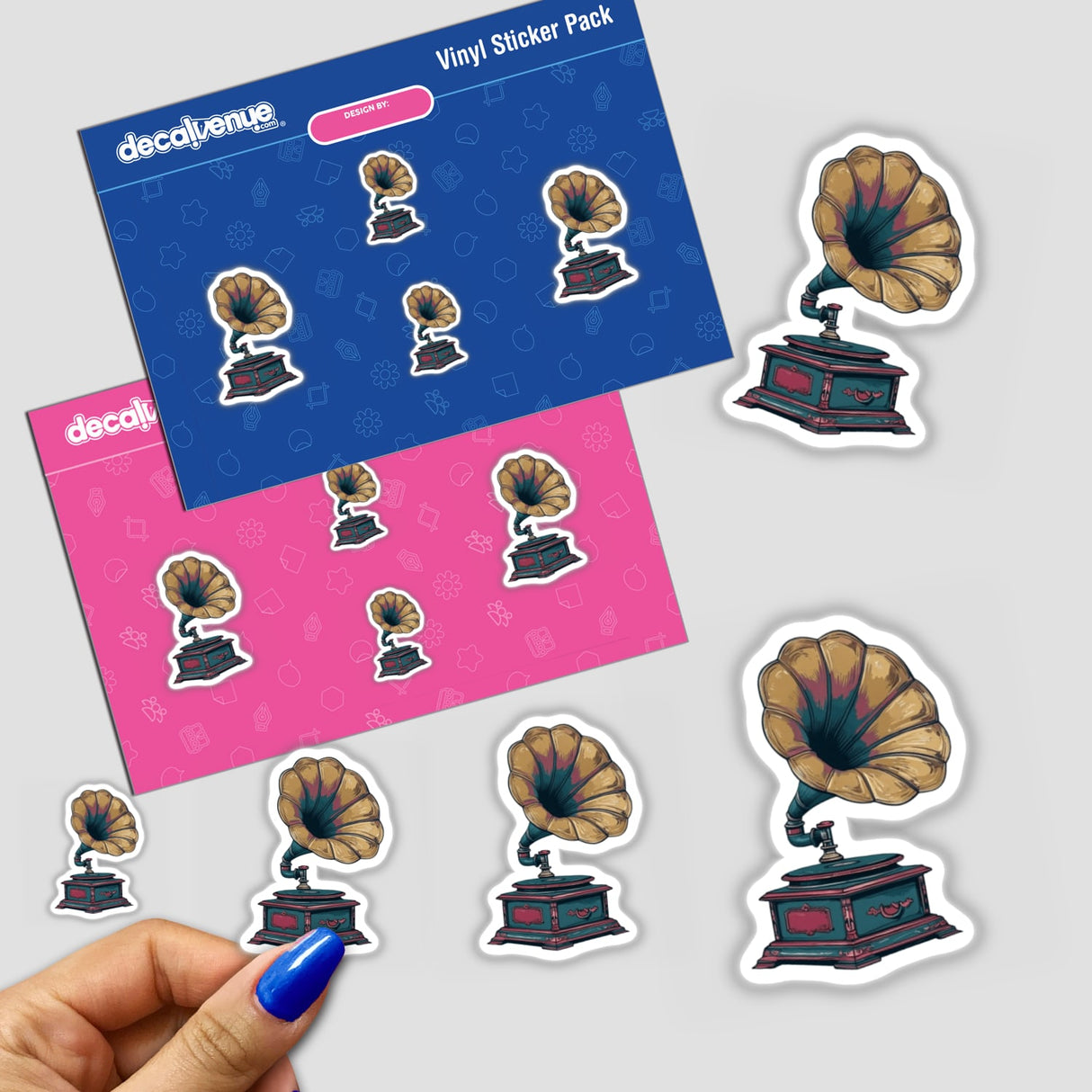 A hand holds the Antique Gramophone | Dark Academia Music Sticker pack, featuring gramophone designs, showcasing Decal Venue's unique sticker collection.