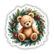 Teddy Bear in a Christmas Wreath sticker or digital artwork featuring a plush teddy bear encircled by a festive wreath, embodying a charming holiday theme, perfect for seasonal decoration.
