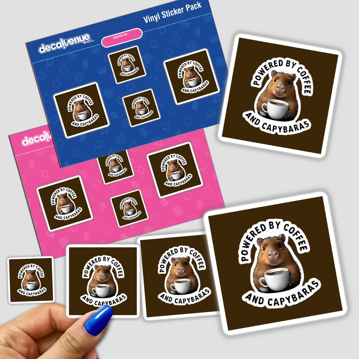 A hand holding a sticker pack featuring a cute capybara clipart with the title Powered by Coffee and Capybaras - Cute Capybara Clipart for Stickers or Commercial Rights Download.