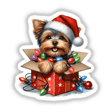 Christmas Lights Santa Yorkie in Gift Box III features a cute Yorkie wearing a Santa hat, adorned with festive lights, sitting in a gift box, available as stickers or digital artwork.