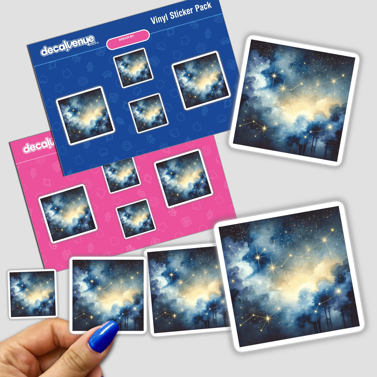 Hand holding Celestial Night - Watercolor Constellations in a Starry Sky stickers featuring stars and trees.