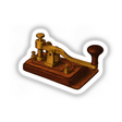 Telegraph Key Clipart PNG & Sticker – Vintage Western Union Printable. Close-up of an ornate 1880s Victorian telegraph key, ideal for crafts, education, and steampunk decor.