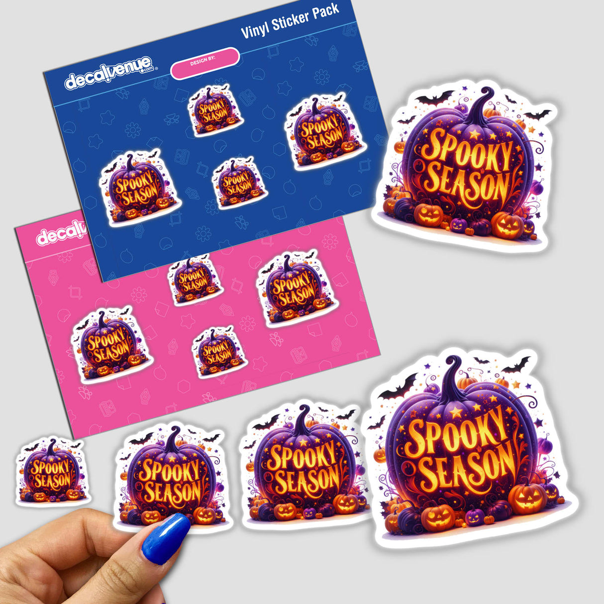 Spooky Season Glowing Pumpkin sticker featuring orange text and bats, held by a hand against a surface. Available as a sticker or digital artwork.
