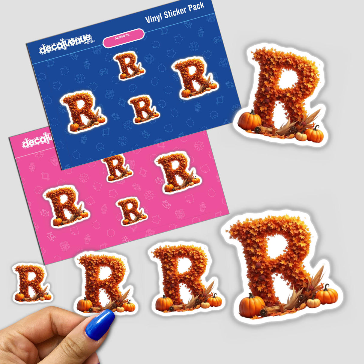 Hand showing Thanksgiving Letter R Clipart sticker featuring fall leaves and pumpkins, available as a sticker or digital artwork for commercial use.