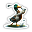 Mallard Duck Hitting Golf Ball sticker or digital artwork featuring a cartoon duck with a golf club, standing on grass, aiming at a close-up golf ball.