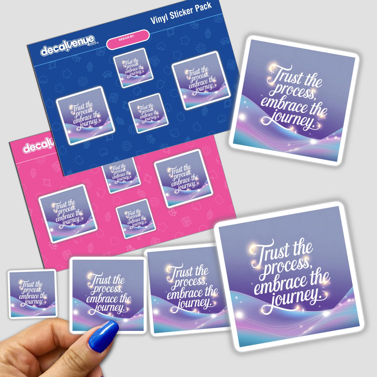 Hand holding 'Trust the process, embrace the journey' sticker pack, showcasing unique vinyl designs from Decal Venue's collection of stickers and digital art.