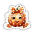 Cheerful polka dot pumpkin with orange bow, surrounded by autumn leaves