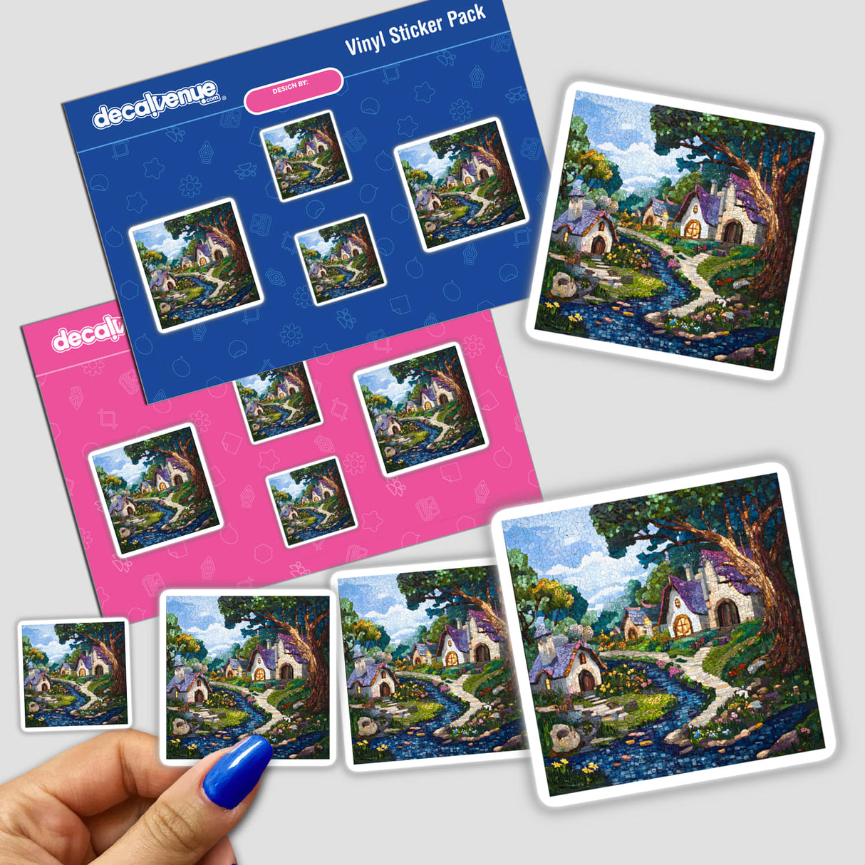 Hand holding Enchanted Forest and Village Mosaic sticker pack featuring vibrant village and river scenes.