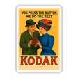 1912 Kodak “You Press the Button, We Do the Rest” Printable or Sticker featuring a man and woman with a camera, capturing early 20th-century style and vintage advertising charm.