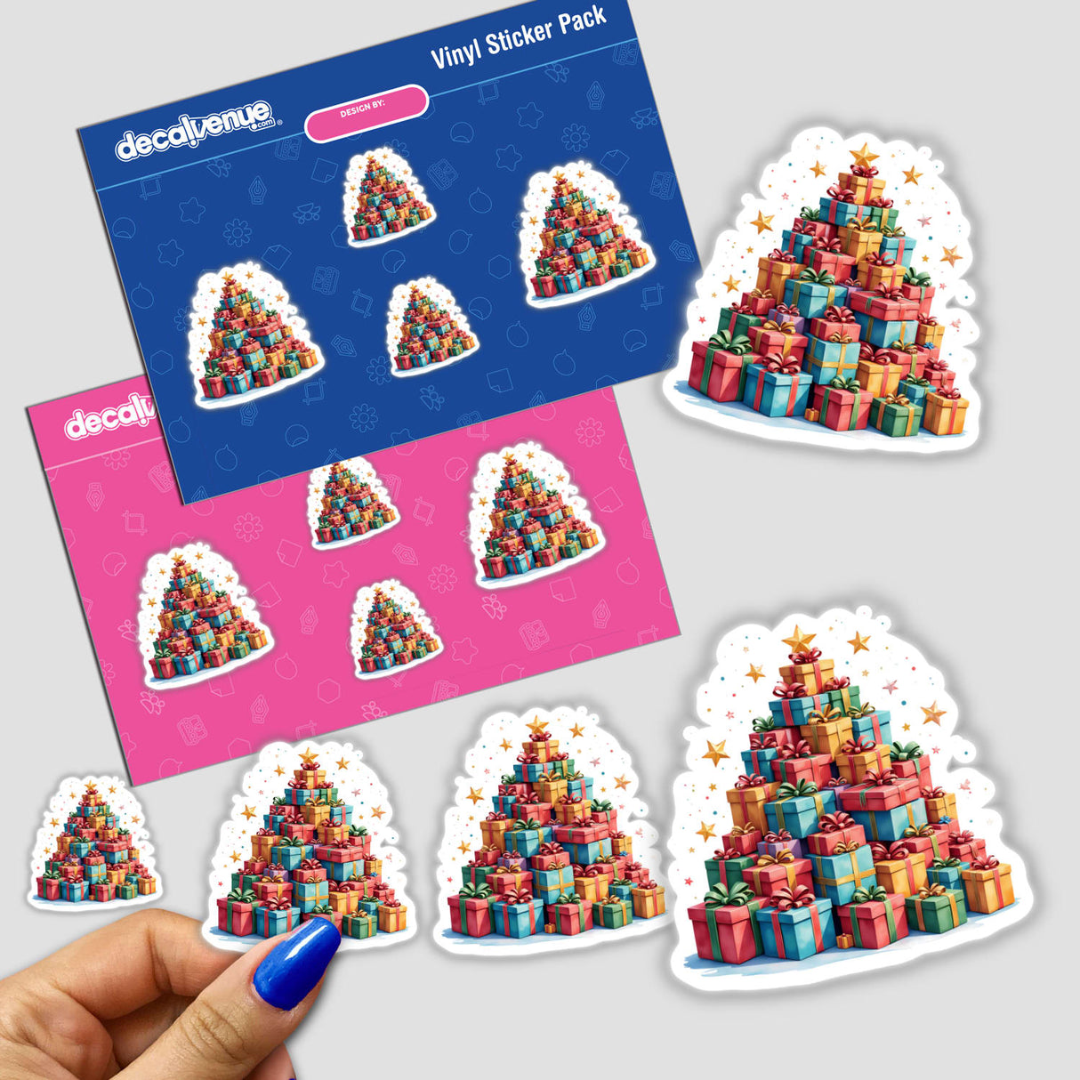 Christmas Presents Tree sticker pack shows a hand displaying a pyramid of gift stickers. Available as stickers or digital artwork, perfect for festive decoration from Decal Venue's unique collection.