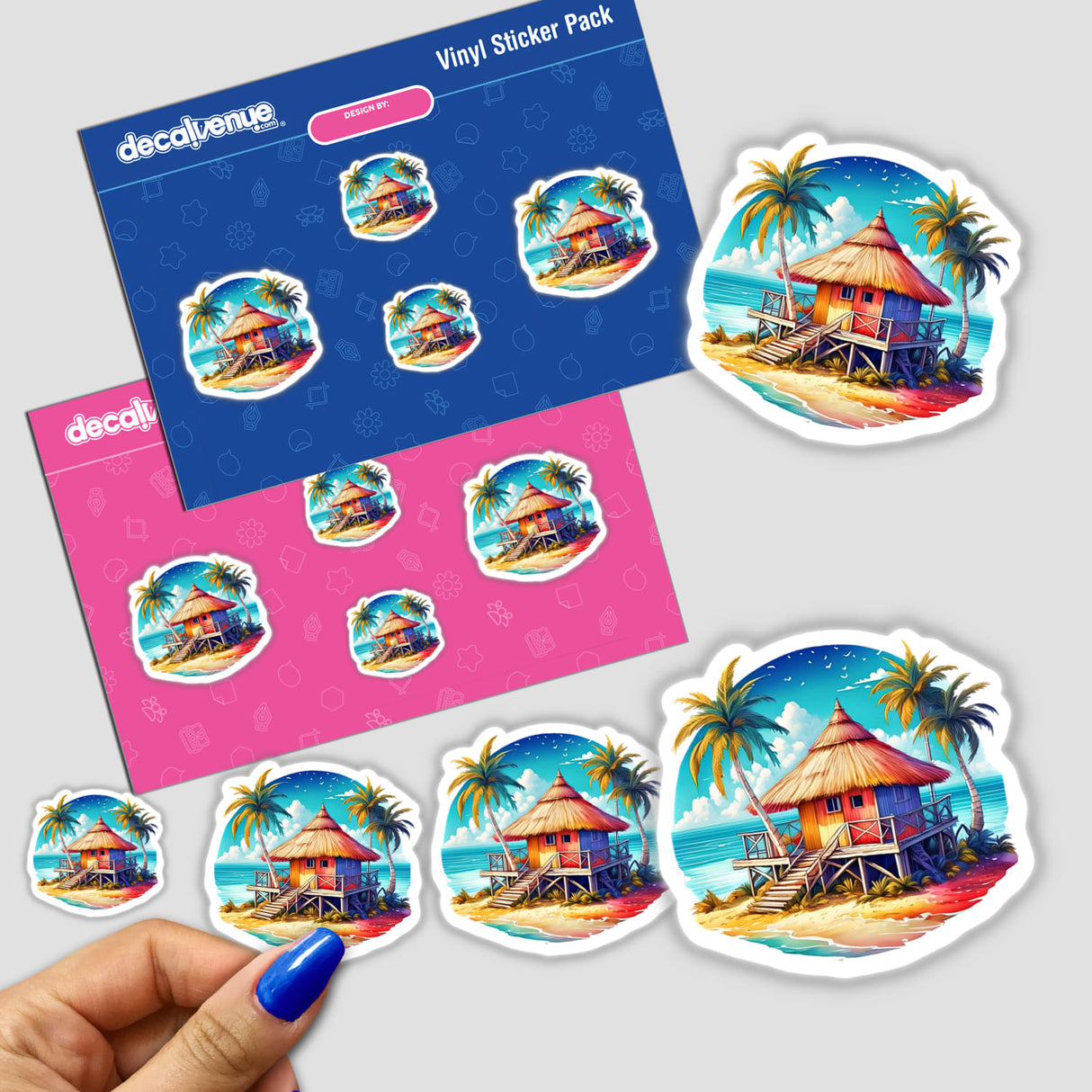 Colorful and vibrant beach hut stickers displayed on a card. The stickers feature tropical palm trees, a thatched roof hut, and a bright blue sky with clouds, creating a lively and summery design. The stickers are part of a vinyl sticker pack from Decal Venue, a store that offers unique stickers and digital art.