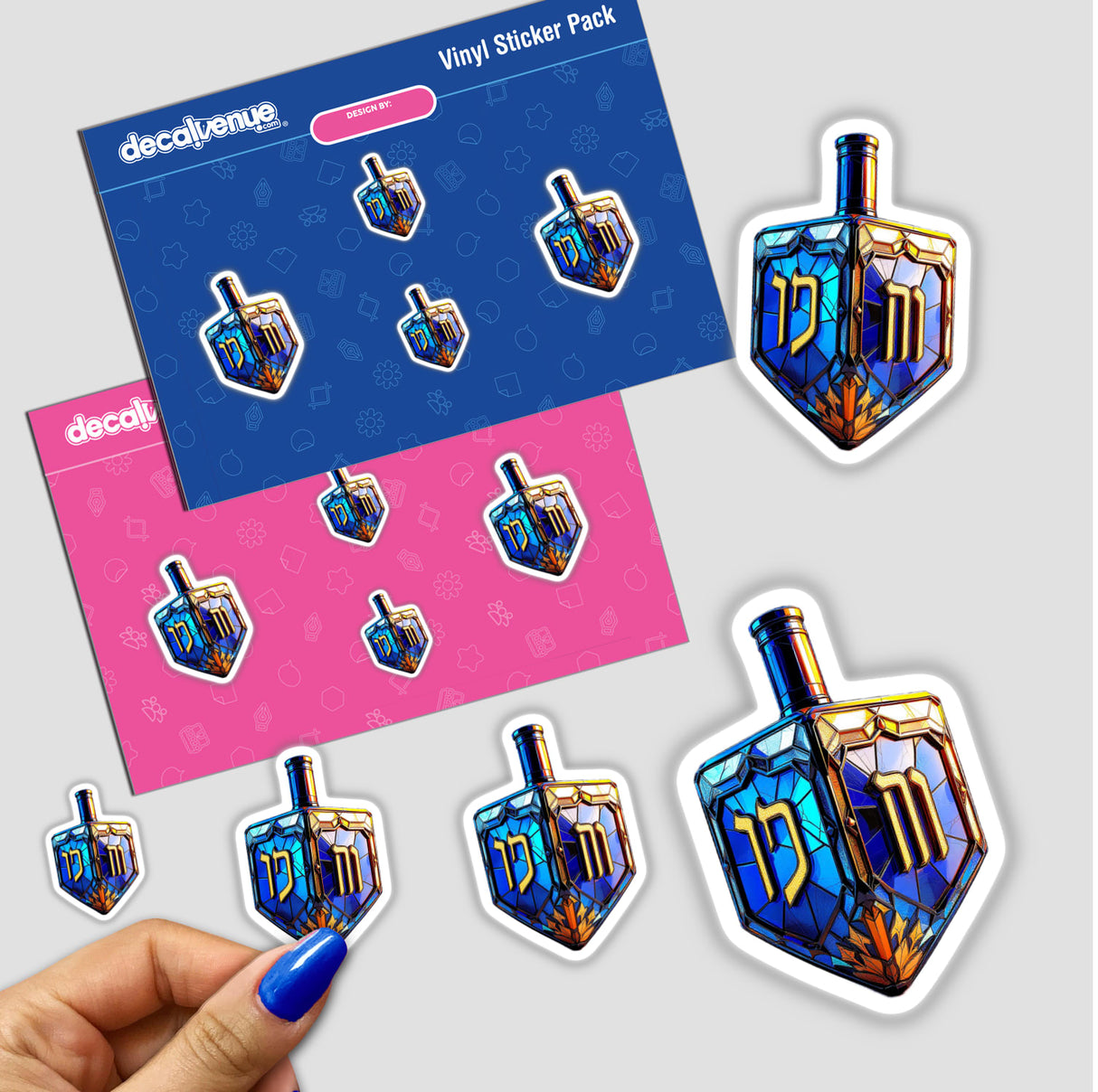 Dreidel Stained Glass Style sticker pack features intricate designs, showcasing a blue and gold dreidel. Available as stickers or digital artwork, perfect for unique decor from Decal Venue.