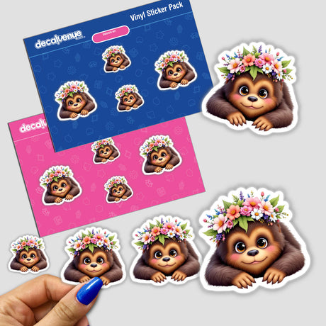 Adorable Sasquatch with a Spring Flower Crown sticker, held by a hand. Features charming cartoon design with floral accents, perfect for nature enthusiasts and collectors. Available at Decal Venue.