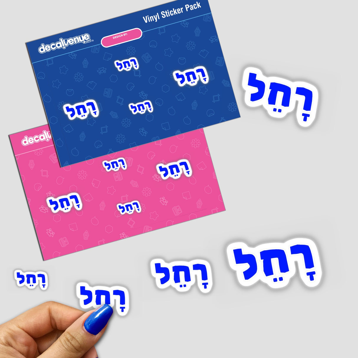 A hand holding the Rachel - רָחֵל Biblical Hebrew Girl Name Sticker pack, featuring intricate blue and pink designs with commercial rights, ideal for unique creations or digital art.