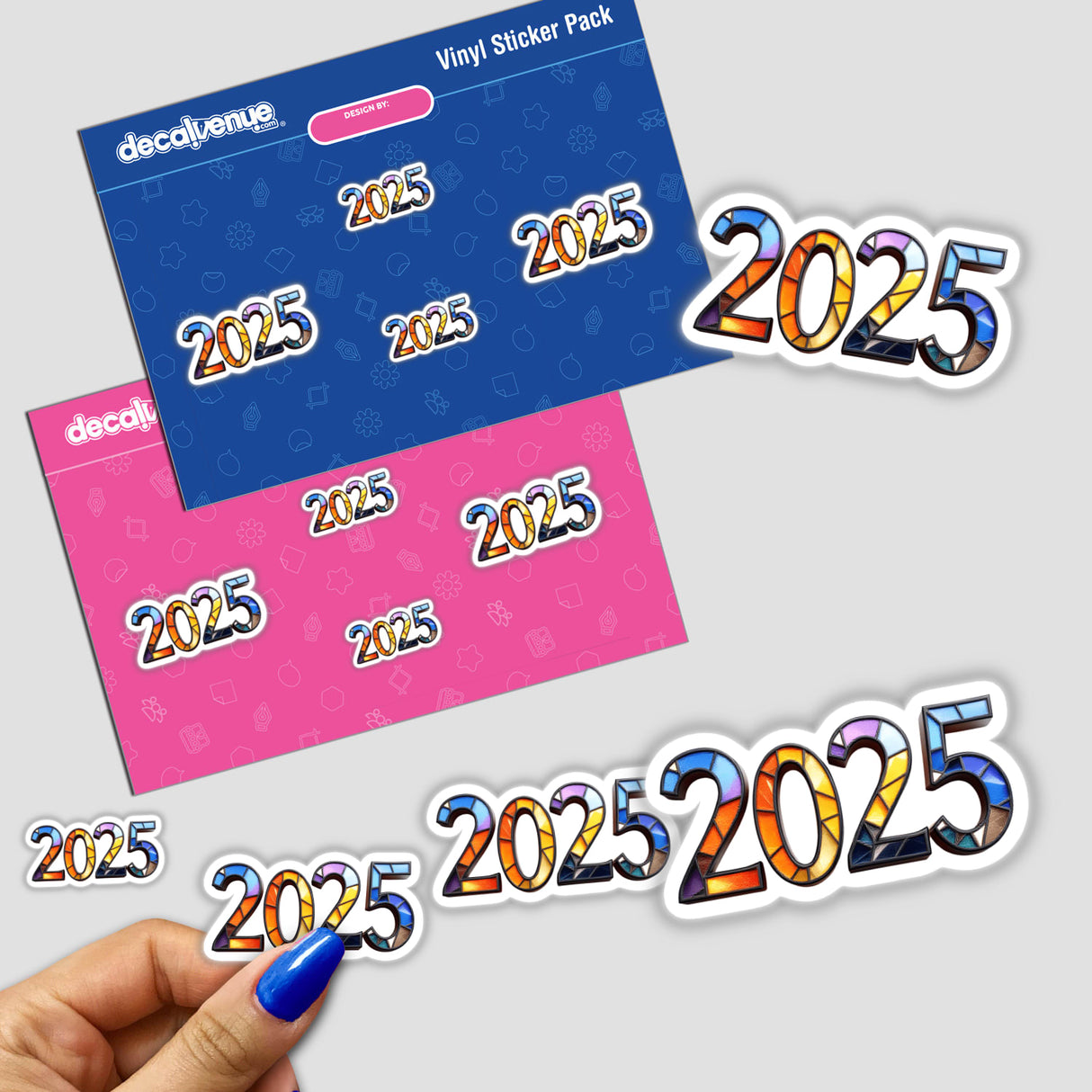Hand holding 2025 Numerals Stained Glass Style stickers, showcasing colorful, artistic numerals. Available as stickers or digital artwork, reflecting Decal Venue's unique design ethos.