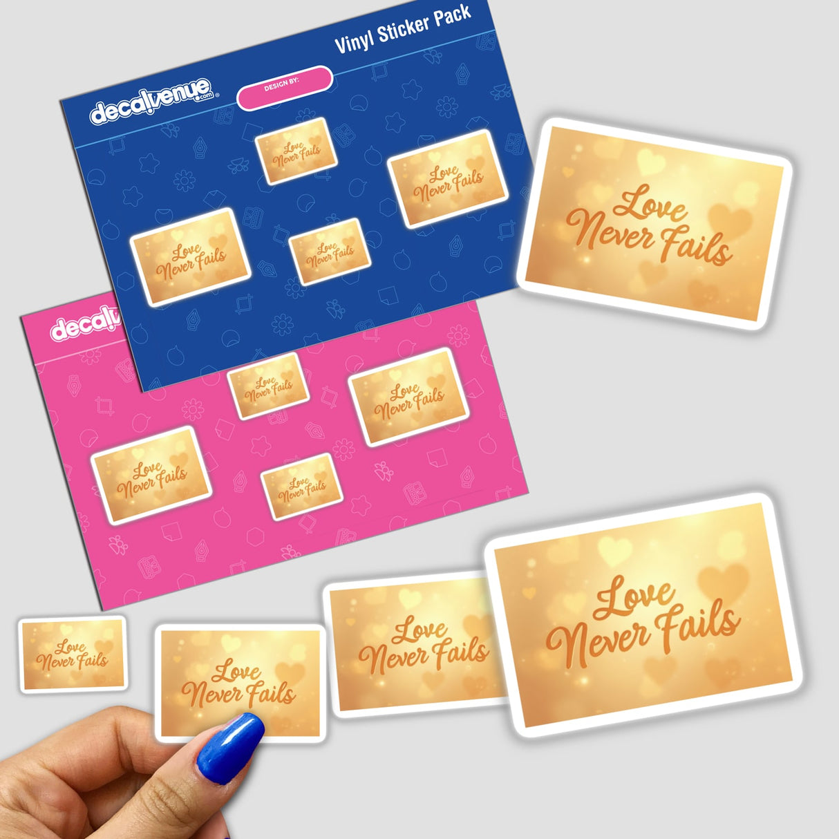 Hand holding a Love Never Fails Sticker & Clipart with 1 Corinthians 13:8 quote, featuring Christian text and design elements. Available as stickers or digital artwork.
