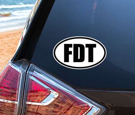 FDT Oval Vinyl Bumper Stickers (3 Pack) displayed on a car's exterior, showcasing their application. The stickers feature high-definition vinyl, emphasizing their smooth, durable finish suitable for various surfaces.