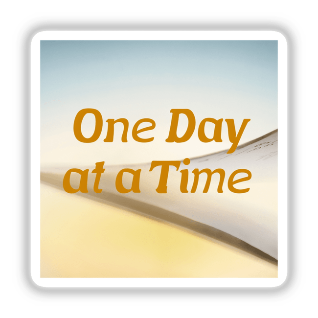 One Day at a Time Sticker - Positive Mental Health Clipart Download, featuring close-up yellow text on a white background, ideal for promoting positivity through unique stickers or digital art.