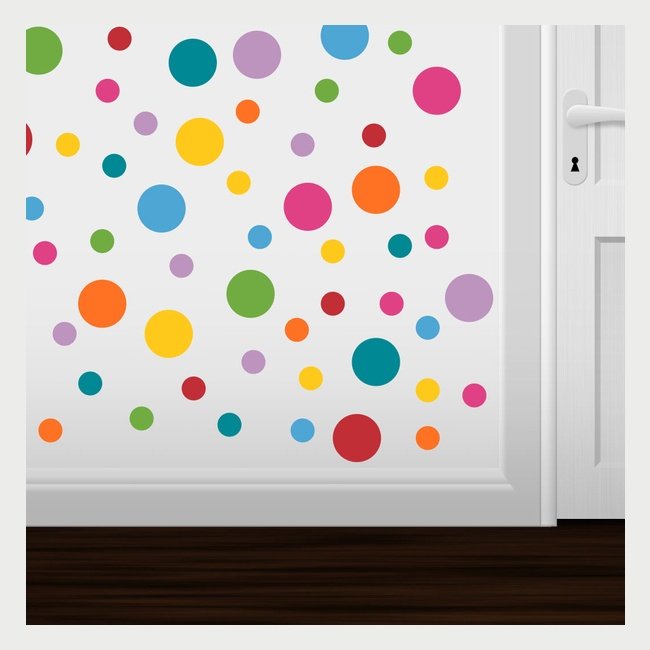 Vibrant polka dot wall decals in various sizes and colors surrounding a white door, creating a playful and decorative wall design.