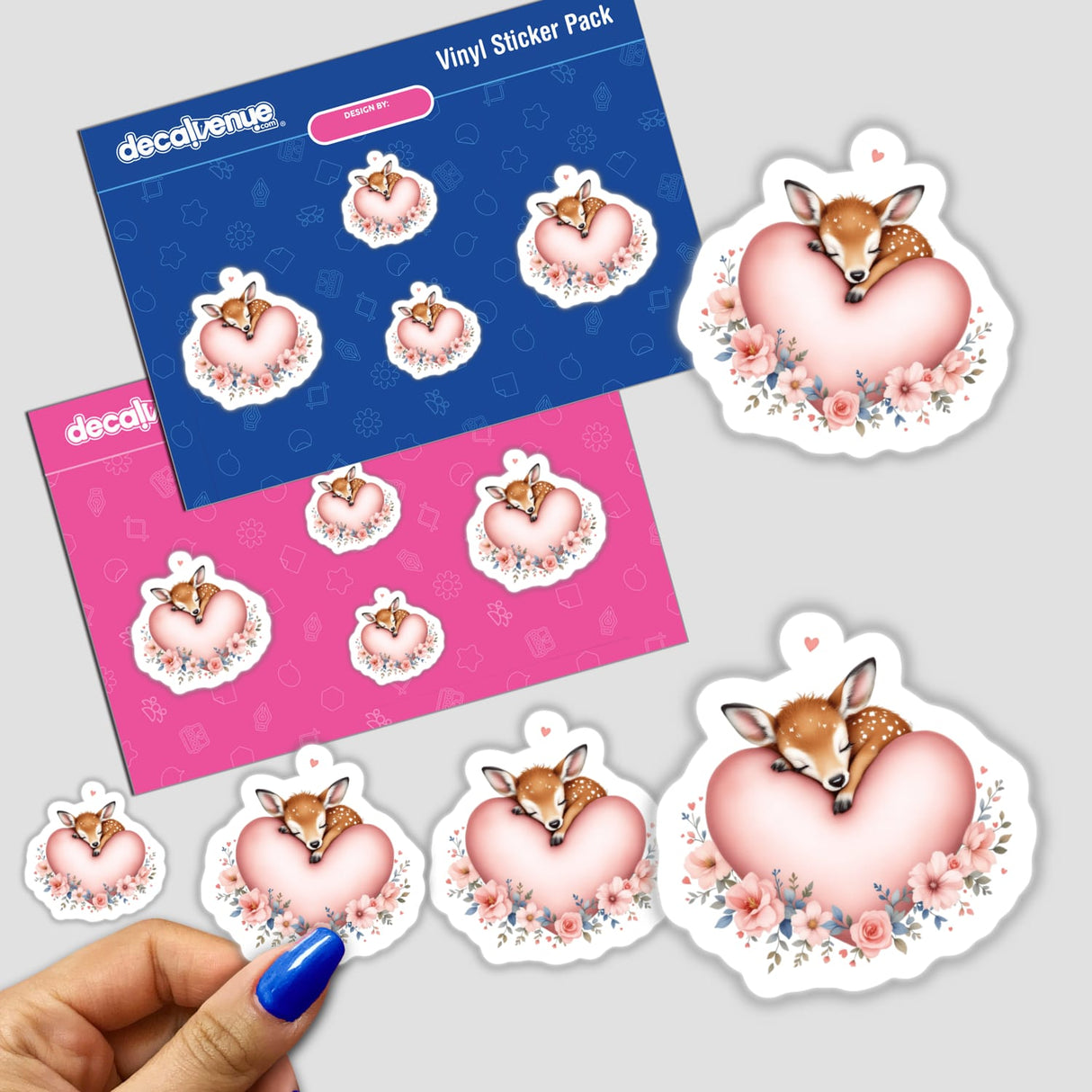 Sleeping Deer on a Heart sticker, featuring a cartoon baby deer peacefully resting on a heart, capturing serene beauty and whimsy, ideal for enhancing personal items with gentle elegance.
