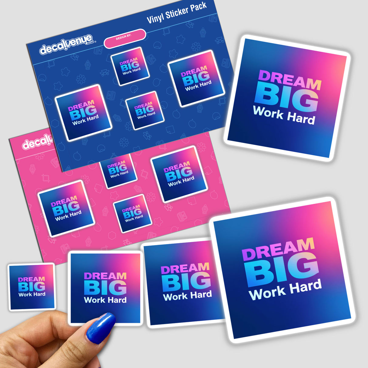 Hand holding 'Dream Big Work Hard' sticker pack, showcasing a diverse collection of motivational designs, available as physical stickers or digital artwork from Decal Venue.