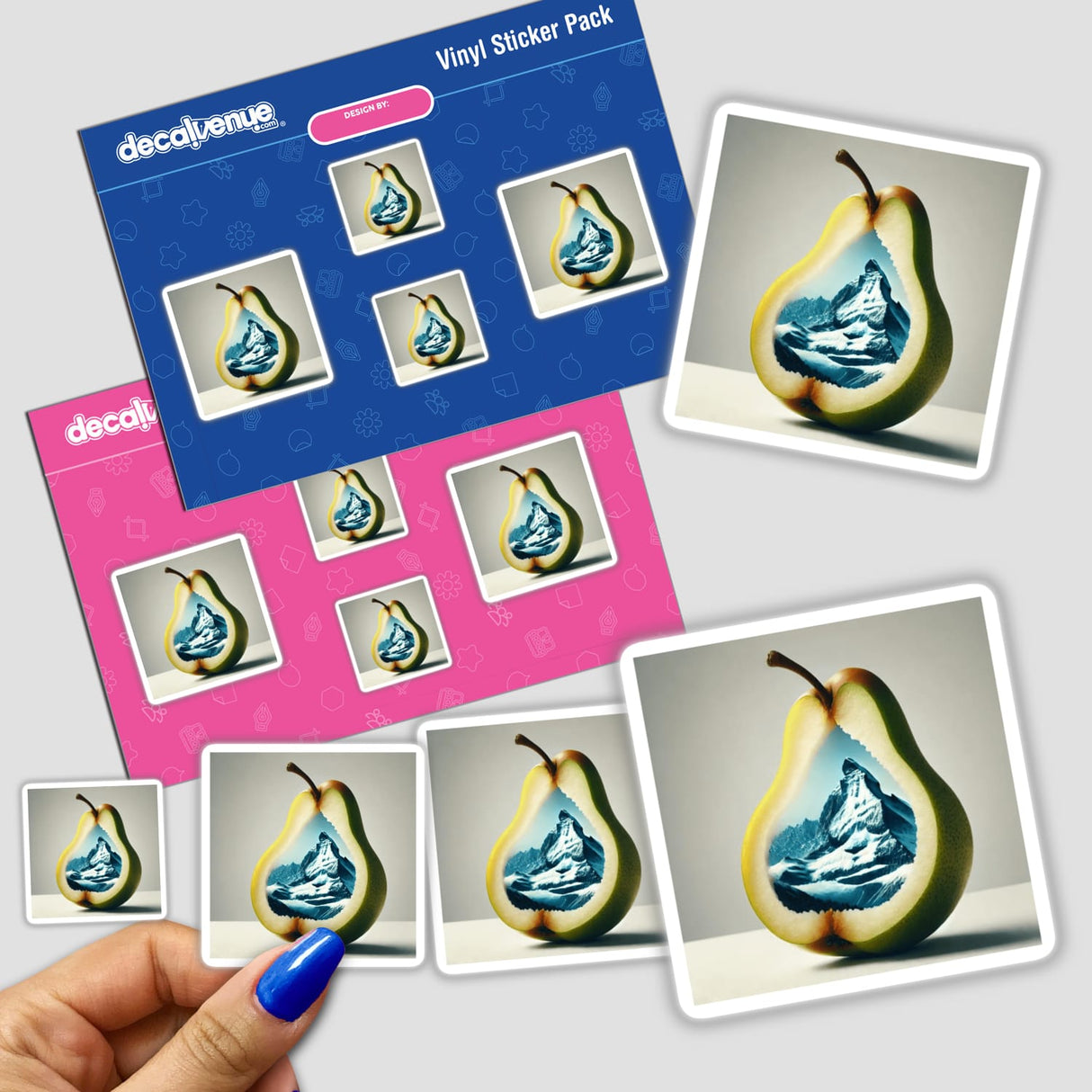Hand holding a sticker pack featuring the design Frosted Peaks Mountain Range Inside a Pear.