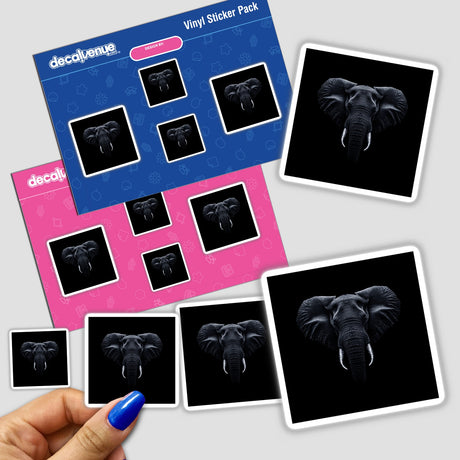 Hand holding a sticker pack featuring the Cinematic Elephant Portrait on Black Background, showcasing detailed elephant heads with tusks and large ears. Available as stickers or digital artwork.