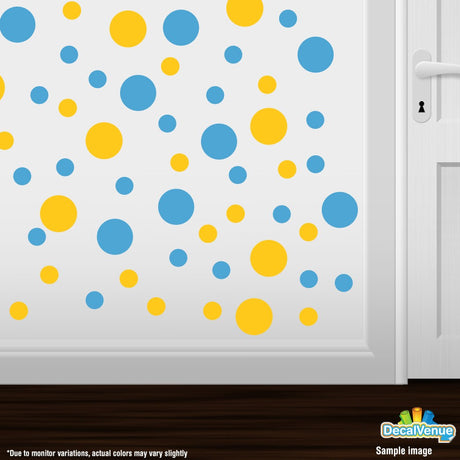 Colorful polka dot wall decals with yellow and blue circles on a neutral background, creating a vibrant and playful design.