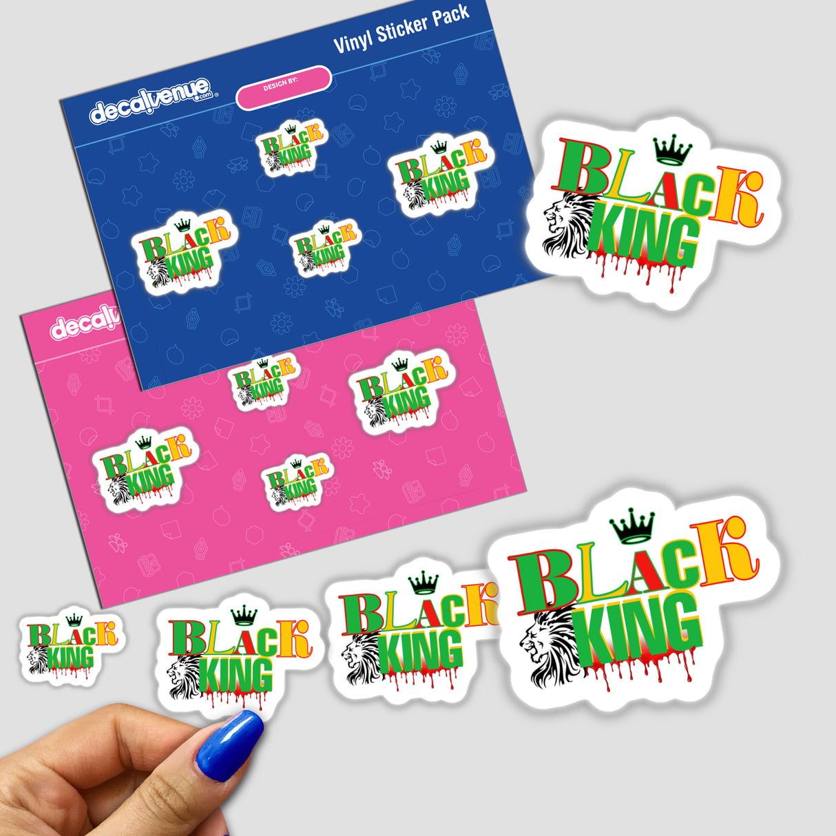 Hand holding African American Black King stickers featuring a lion head with a crown.