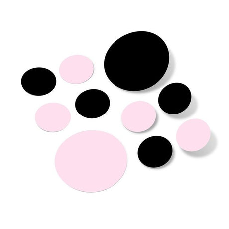Baby pink and black polka dot circle wall decals on white background.